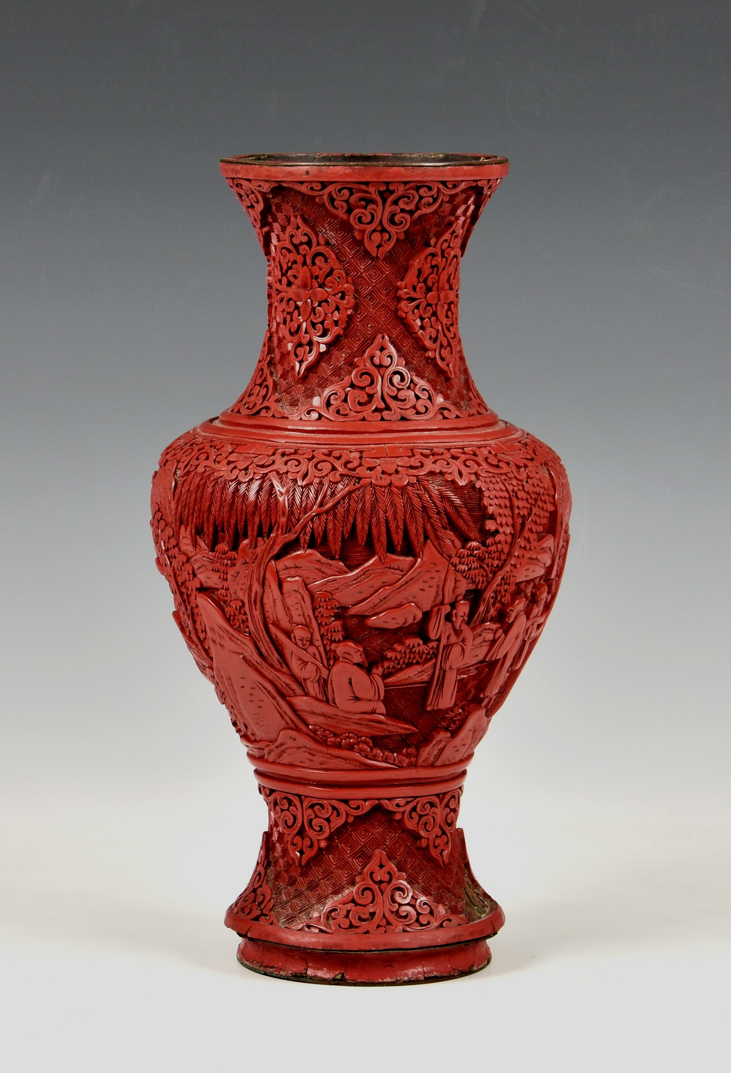 A Chinese carved cinnabar lacquer vase, probably late 19th / early 20th century, baluster form,