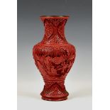 A Chinese carved cinnabar lacquer vase, probably late 19th / early 20th century, baluster form,