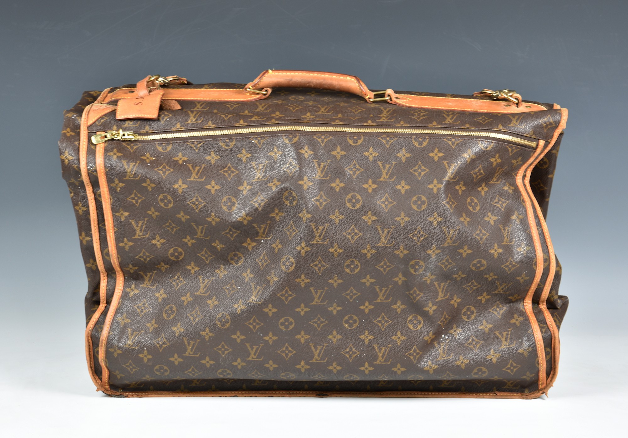 A Louis Vuitton monogram canvas suit carrier 60, with Vachetta leather handle and trim, gold tone