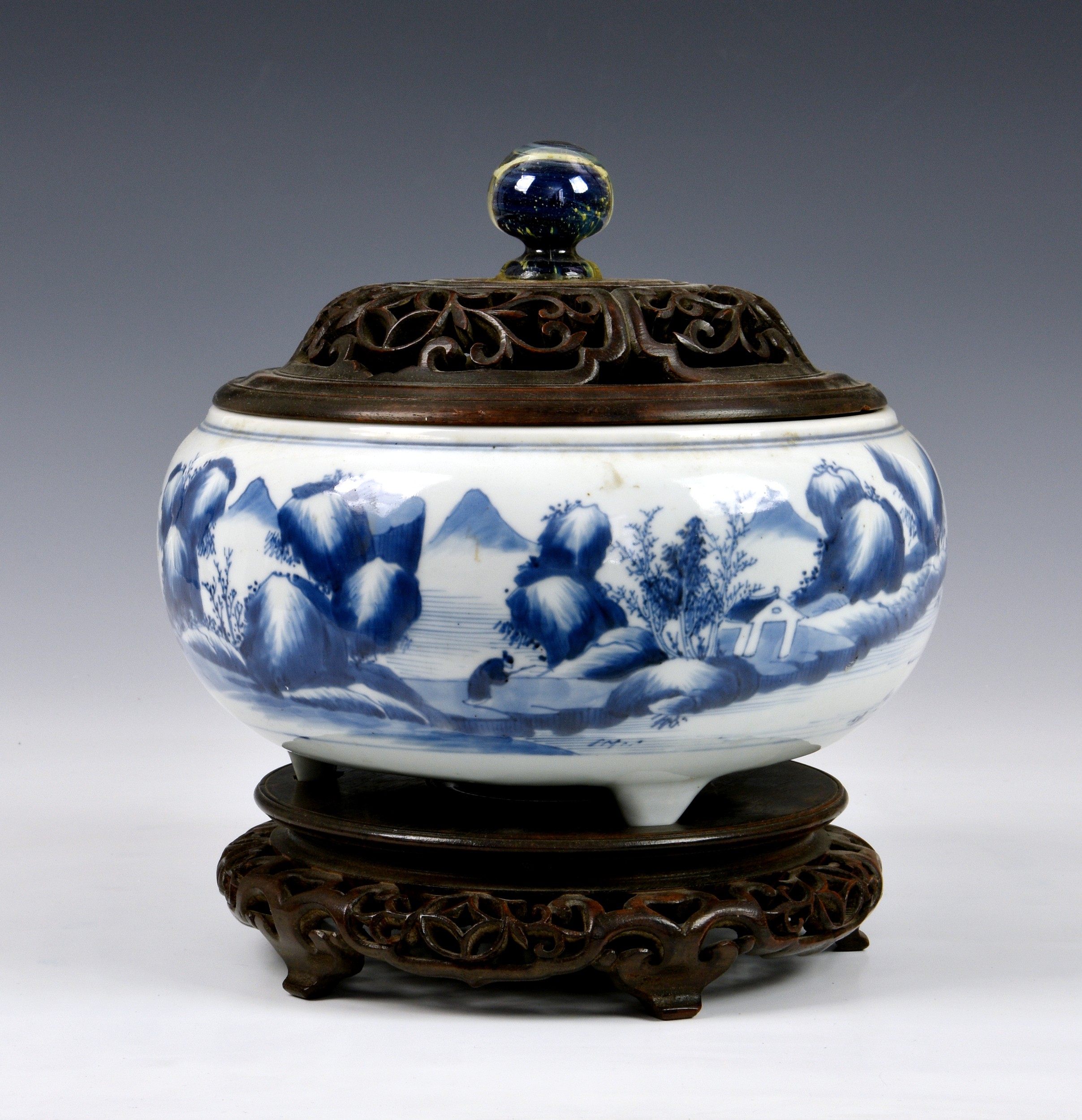 A Chinese blue and white tripod censer, 18th / 19th century, of bun form with short triangular feet,