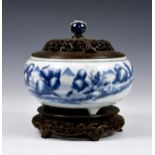 A Chinese blue and white tripod censer, 18th / 19th century, of bun form with short triangular feet,