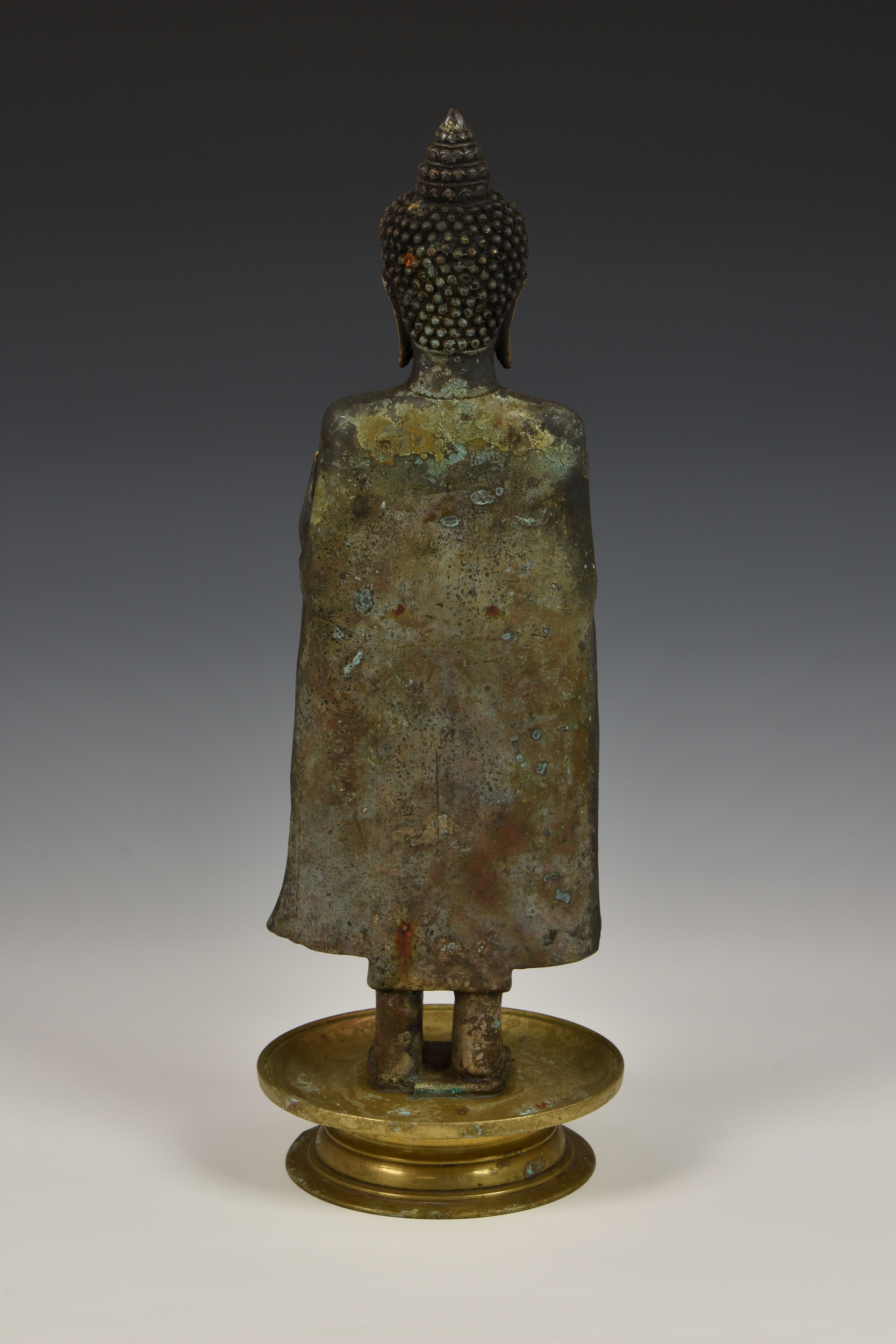 A gilt and black-lacquered figure of Buddha Shakyamuni, Thailand, cast metal Buddha, standing in - Image 8 of 9