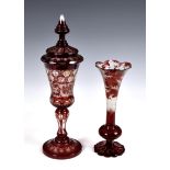 A late 19th century Bohemian ruby flashed and finely wheel cut glass covered goblet, decorated