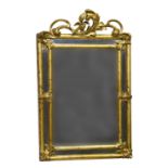 An 18th century French giltwood mirror, the rectangular plate with foliate cornered, divided half-
