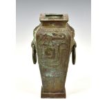 A modern Chinese archaistic style bronze vase, of tapering square form with stylised mythical