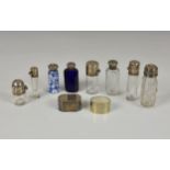 A collection of eight silver mounted scent bottles, of varying sizes, dates and styles, to include a