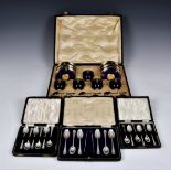 A cased set of Royal Worcester coffee cups, saucers and enamelled silver spoons, date code 1926,