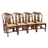 A set of eight George III style mahogany dining chairs, including a pair of carvers, the slightly