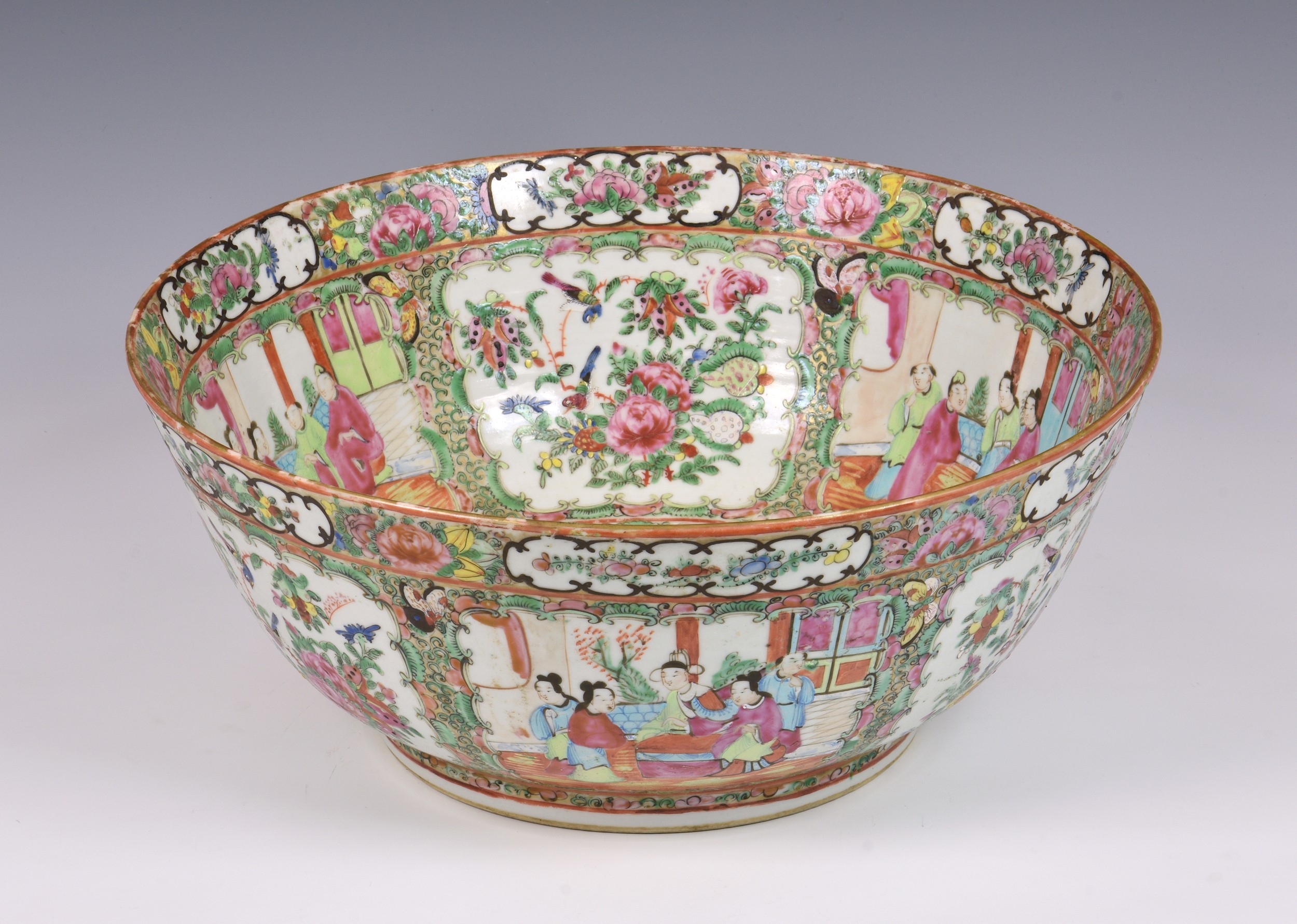 A large Chinese Canton famille rose punch bowl, 19th century, typically enamelled with alternate