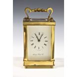 A modern single train brass carriage clock by the London Clock Co., lacquer a/f, with key, winds and