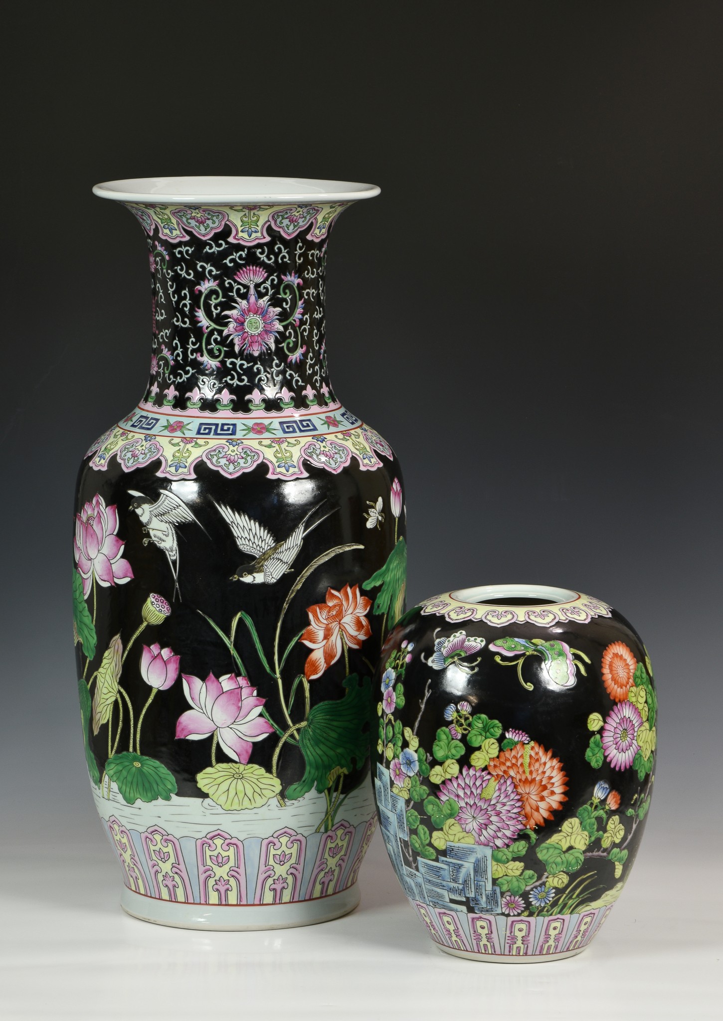 A Chinese porcelain black ground large baluster vase, second half 20th century, painted in famille