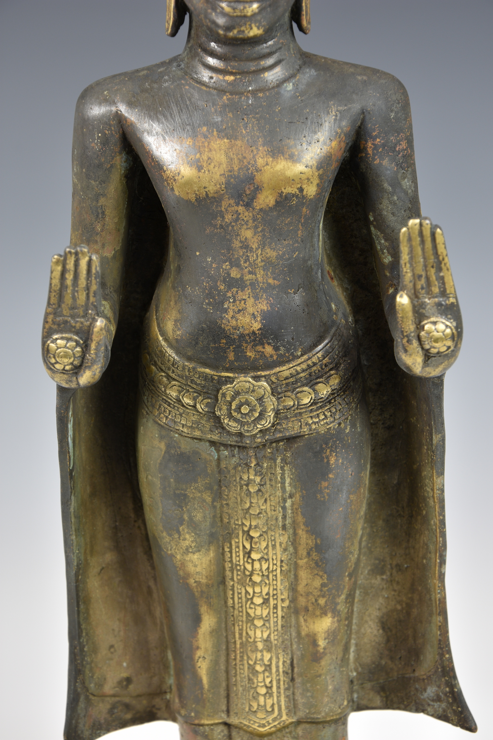 A gilt and black-lacquered figure of Buddha Shakyamuni, Thailand, cast metal Buddha, standing in - Image 3 of 9