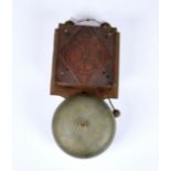 An antique cast iron and carved walnut school or alarm bell, electrically operated with carved