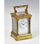 A French gilt brass carriage clock with repeat, c.1900, with Corinthian column case, Roman white