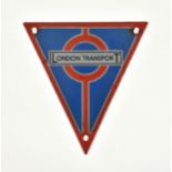 A vintage enamel London Transport Routemaster radiator badge, of triangle form, earlier enamel