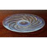 A Rene Lalique opalescent 'Poissons' dish, with spiralled fish around central air bubbles, 'R.