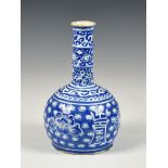 A Chinese slip decorated blue glazed stoneware bottle vase, probably 19th century, the cylindrical