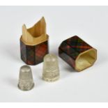 A Tartan Ware octagonal thimble case with silver thimbles, size five thimble by Charles Horner,