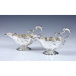 An extremely rare pair of George II silver rococo style sauce boats, Pezé Pilleau, London, 1743,