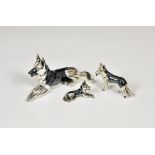 A set of three graduated silver '925' Alsatian dog models in various poses, each stamped 'ITALY