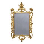 A George II style giltwood mirror, late 20th century, the rectangular plate in a foliate, scroll and