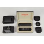 A Minox LX subminiature 'spy' camera, black, in the original case, with leather carrying case with