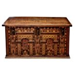 A 16th / 17th century and later Anglo-German Nonesuch style chest, the later oak top on iron strap