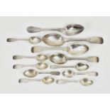 A collection of bright cut fiddle pattern silver spoons, to include a table spoon by Josiah Williams