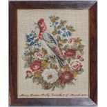 A Victorian Guernsey needlework picture, the petit point picture of a bird amidst garden flowers