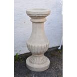 A composite stone sundial pedestal, of half gadrooned baluster form, 30in. (76.2cm.) high, no