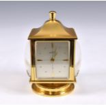 An Angelus desk compendium weather station, with rotating brass body with clock, barometer,