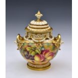 A Royal Worcester large two handled urn and cover, hand-painted with fruit, by D Shinnie, with an