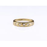 A 9ct gold and diamond five stone ring, the brilliant cut diamonds totalling approx. 0.15ct, set