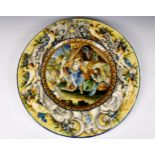 An 18th century Italian Majolica charger of massive proportions, decorated with a classical scene of