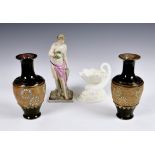 A small collection of antique ceramics, to include a Continental earthernware semi-nude female