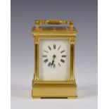 A Grande Sonnerie gilt brass carriage clock with push button repeat, early 20th century, no. 422, in