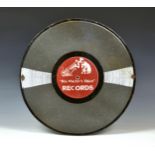 A vintage enamel "His Master's Voice" RECORDS advertising sign, in the form of a 78 shellac