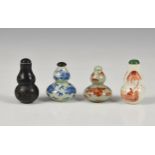 Four Chinese porcelain double gourd snuff bottles, probably 20th century, of varying forms and