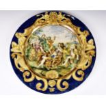 An 18th century Italian Majolica charger of massive proportions, decorated with a classical scene of