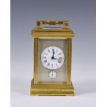 A Grande Sonnerie gilt brass carriage clock made for the Chinese market, with push button repeat and