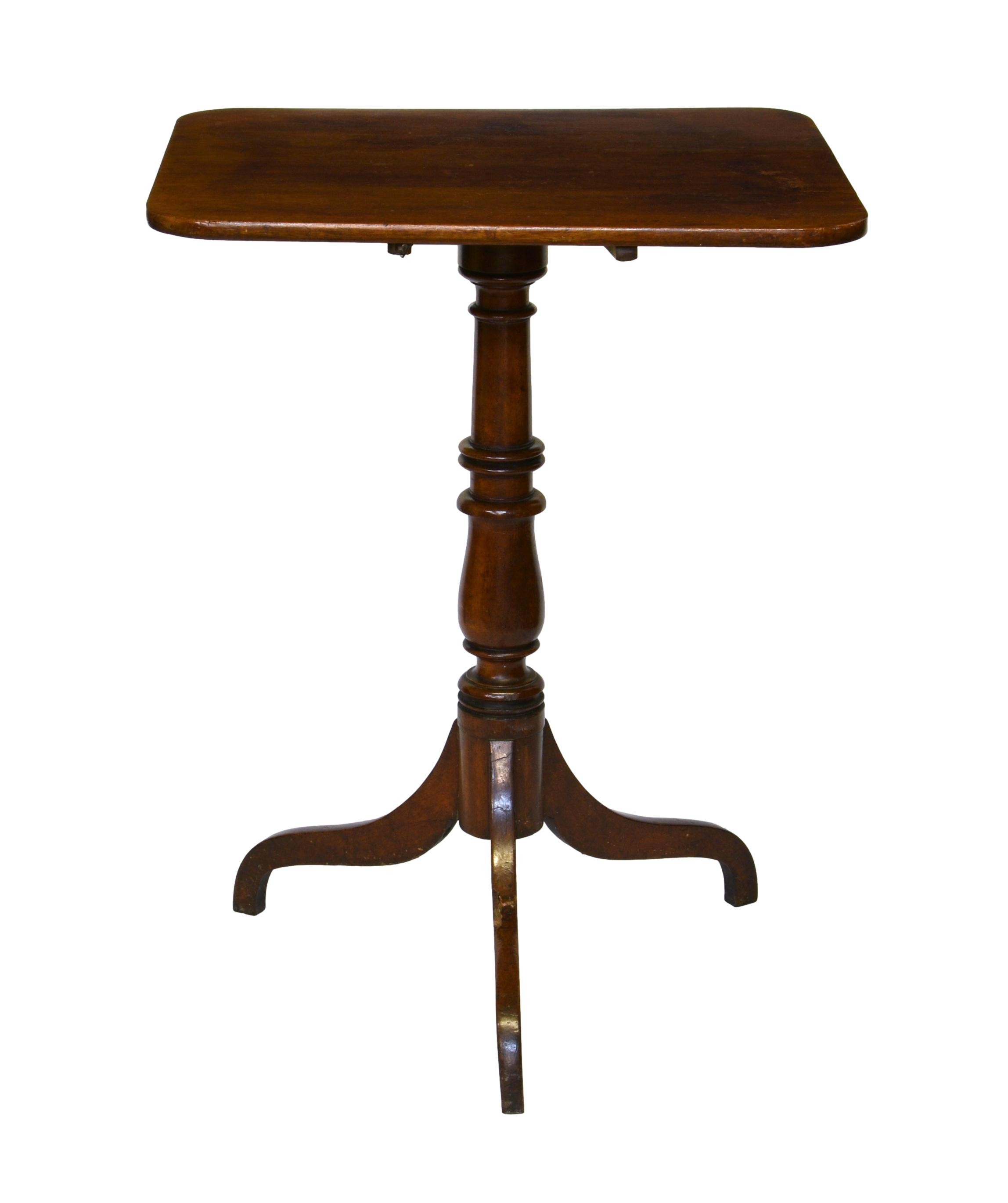 A 19th century rectangular mahogany tilt-top tripod table, with turned baluster column to three