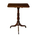 A 19th century rectangular mahogany tilt-top tripod table, with turned baluster column to three