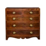 A George IV mahogany and satinwood bowfront chest of drawers, the satinwood cross banded top with