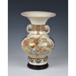 A Japanese earthenware Satsuma vase and stand, Meiji period (1868-1912), of baluster form with