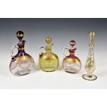 A graduated set of three Bohemian glass flagons, late 19th century, having graduated tinted pink and