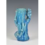 A Majolica turquoise glazed macaques vase, late 19th / early 20th century, the Orientalist vase