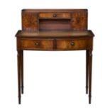 A reproduction 19th century style mahogany bowfront bonheur du jour, the raised back with single