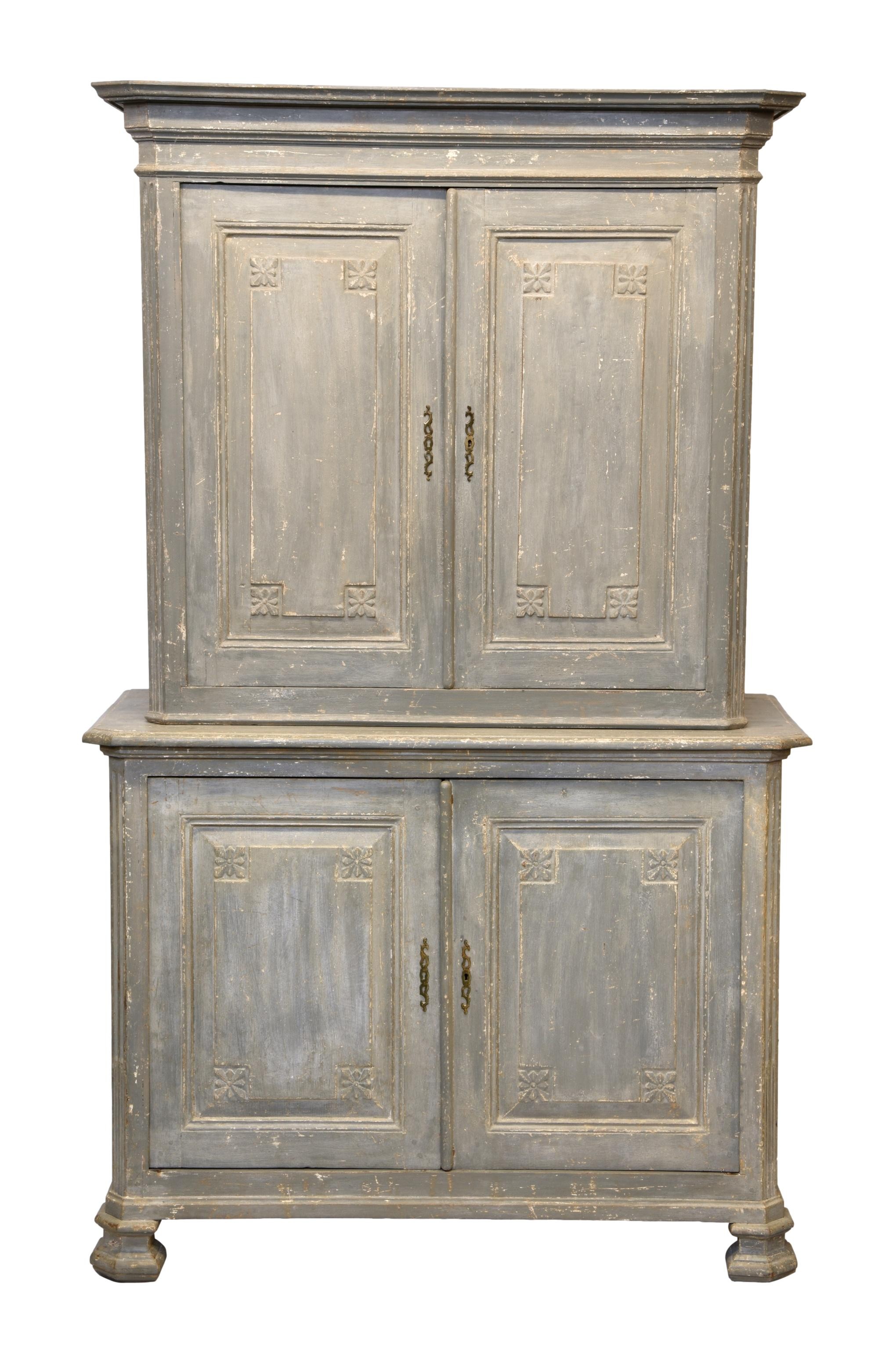 A 19th century French painted oak dresser, the flared, moulded cornice over a pair of panelled doors