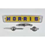Motoring - Morris badges, comprising a plastic trade sign, 21 ½in. (52cm.) long; Morris Minor