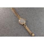 A ladies Rolex Precision 9ct gold manual wind wrist watch, the Dennison case hallmarked Birm.